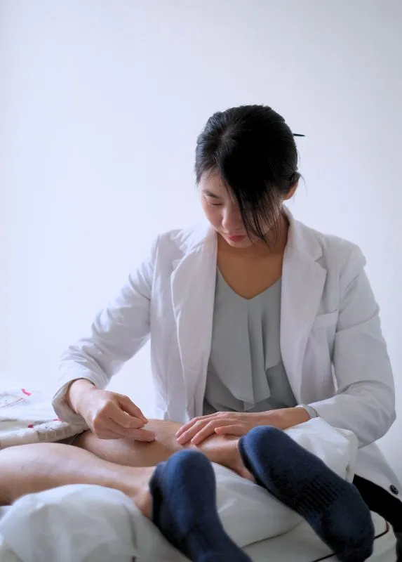 RCMP Priscilla Choi performing acupuncture